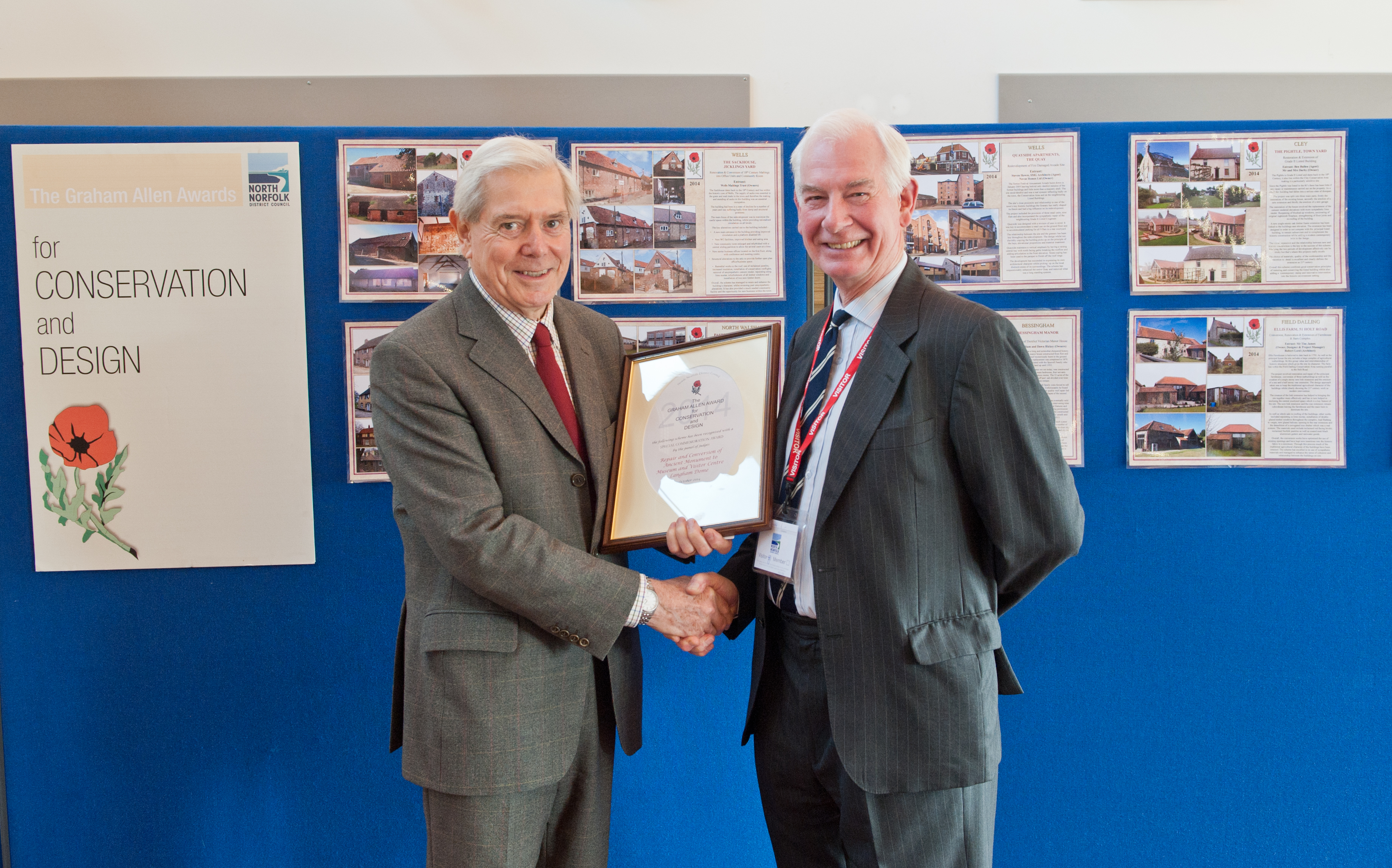 Malcolm Crowder (left) accepts the award on behalf of North Norfolk Historic Buildings Trust, from Edward Allen representing the Allen family