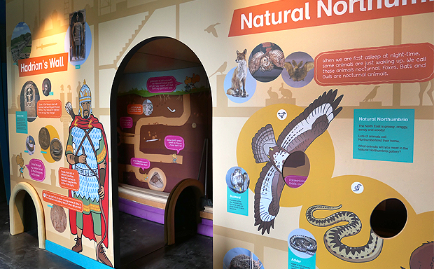 A big 'mouse hole' shape is cut into the displays for young visitors to explore through.