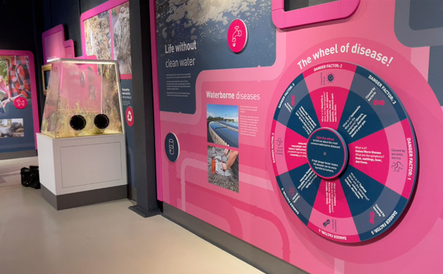 A photo showing the wheel of disease and goo box physical interactives.
